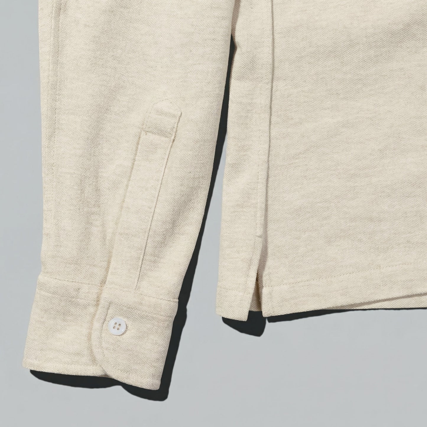 Polo Manga Larga · Crudo Mélange (RESERVA)